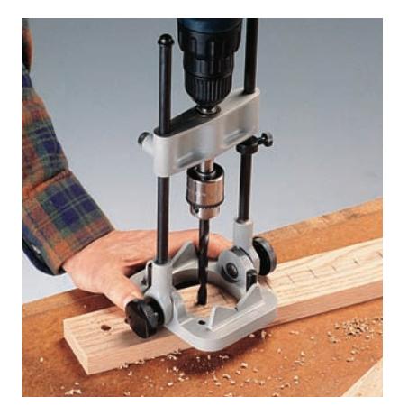 A portable drill stand helps you drill straight or angled holes.