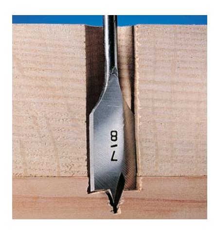 Use a scrap backer board to prevent tearout when drilling through a workpiece.