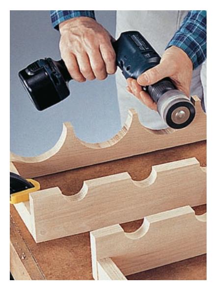 Smooth curves and hard-to-reach surfaces with a drum sander attachment on your power drill.