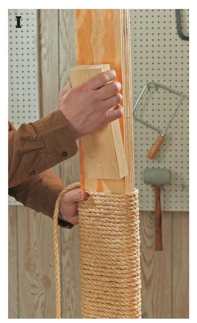 Wrapping sisal rope tightly around a ramp, compressing it with a wood block