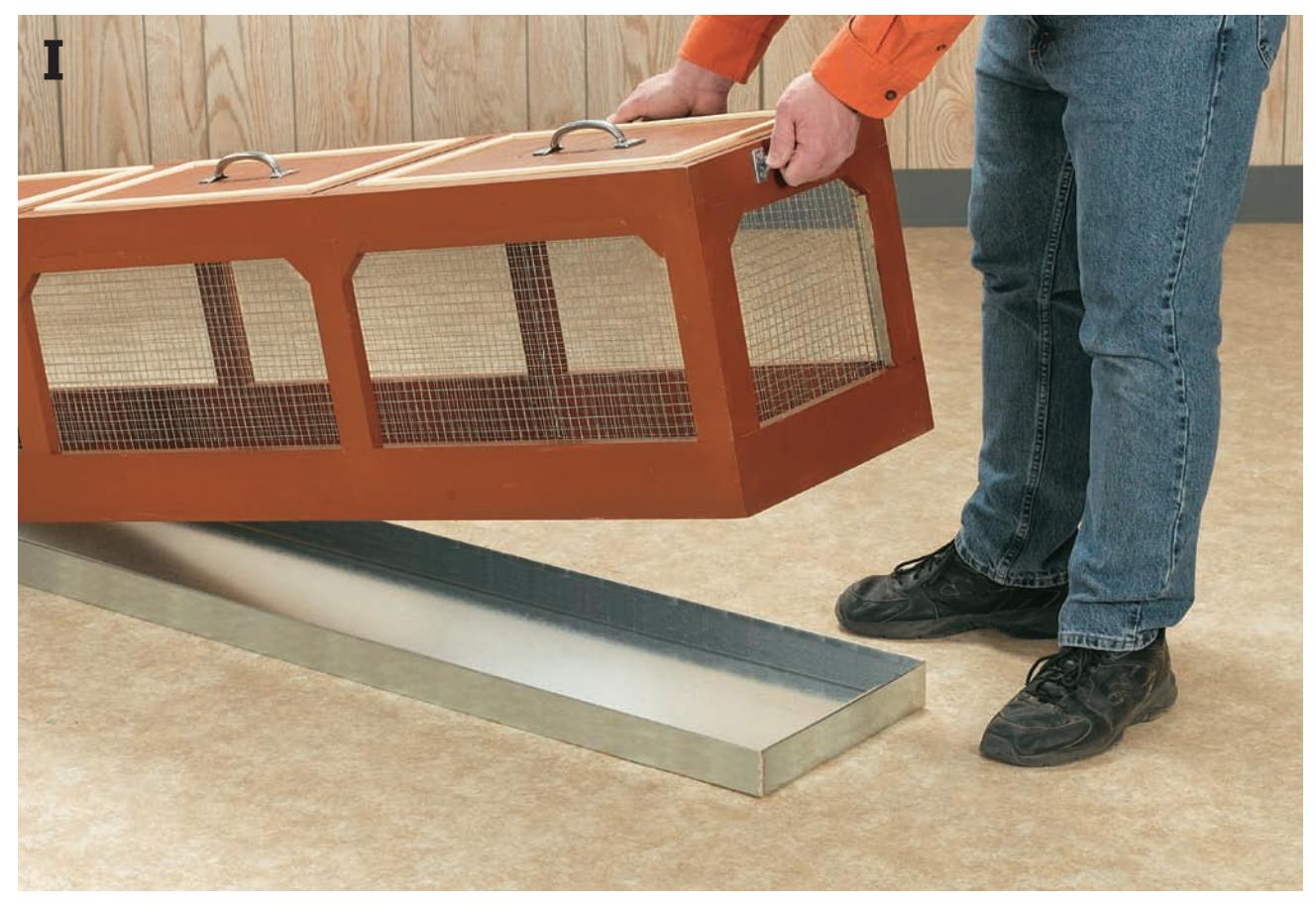 Lower the cage down over the tray and set it in place.