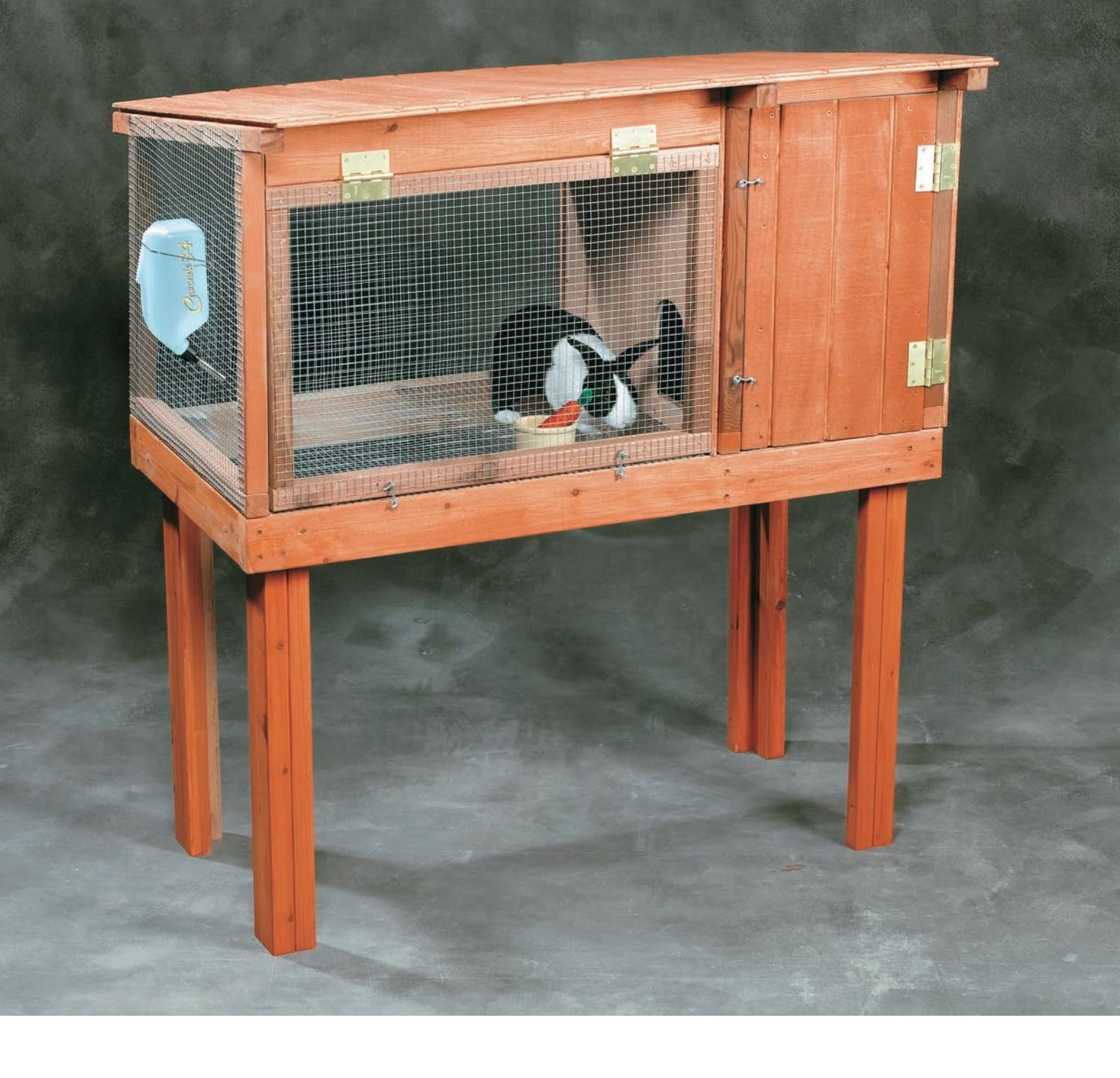 Diagram of a rabbit hutch with two compartments and doors.