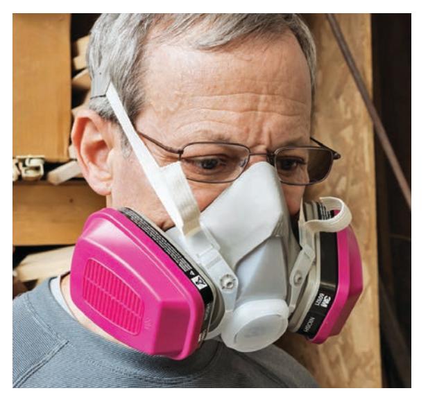 Respirator with dual cartridges for filtering fumes