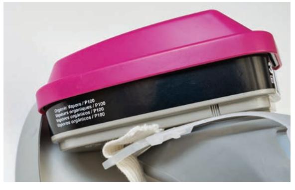 Label on a respirator cartridge showing usage information