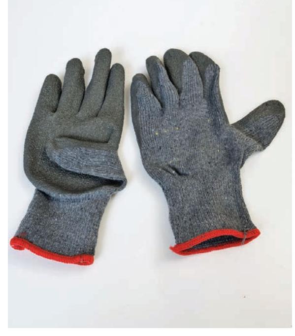 Knit work gloves with rubberized palms