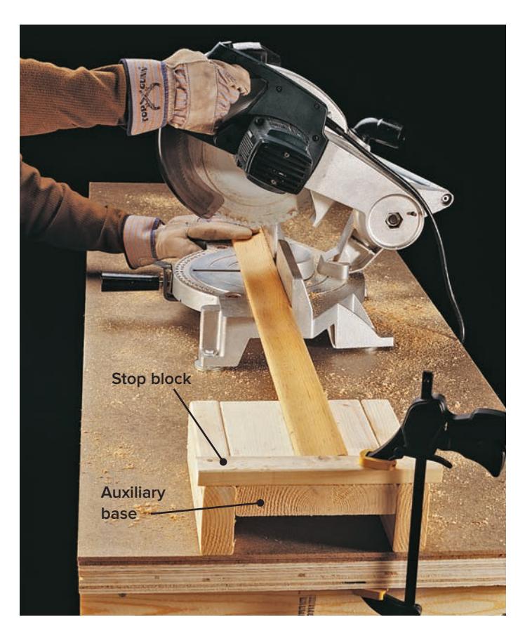 Making shoulder cuts on a workpiece using a table saw.