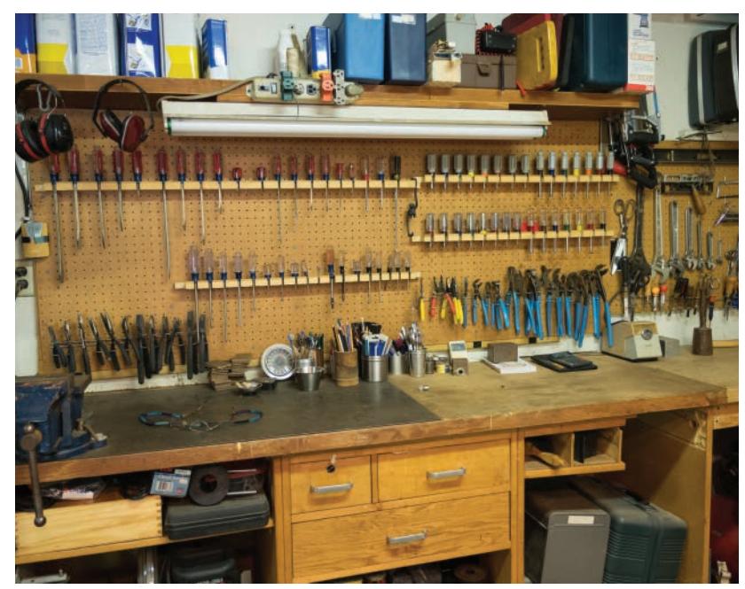 Workshop with extensive hand tool organization on pegboard