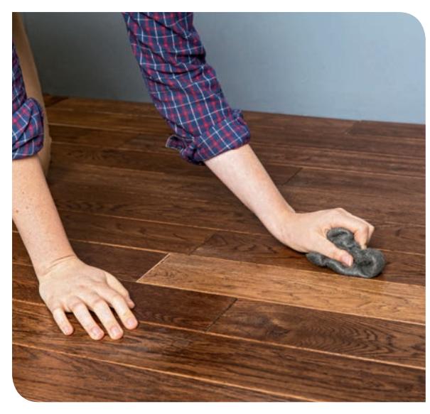 Rub steel wool on the floor to check for paste wax.