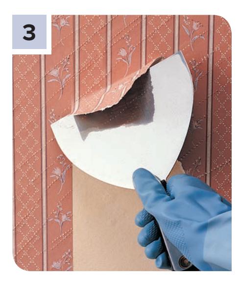 Peeling away loosened wallcovering