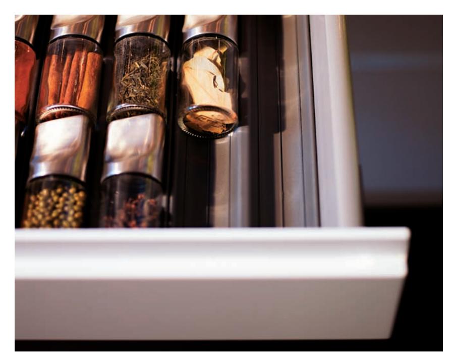 Built-in spice rack in a base cabinet drawer