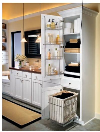 Door-mounted storage shelves and pull-out hamper in a bathroom