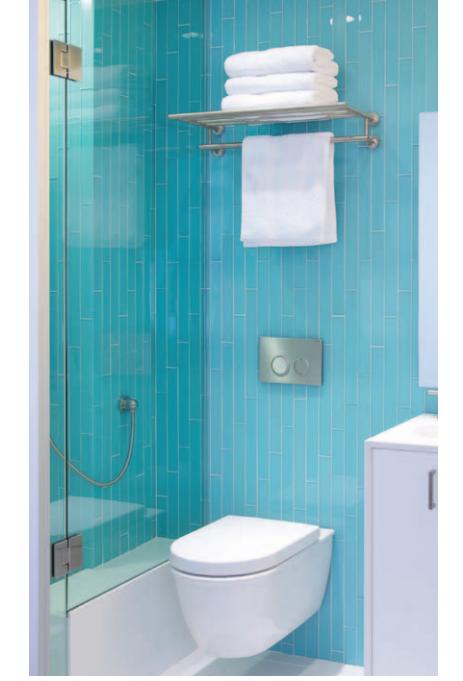Small bathroom with diagonal glass tiles and wall-mounted toilet.