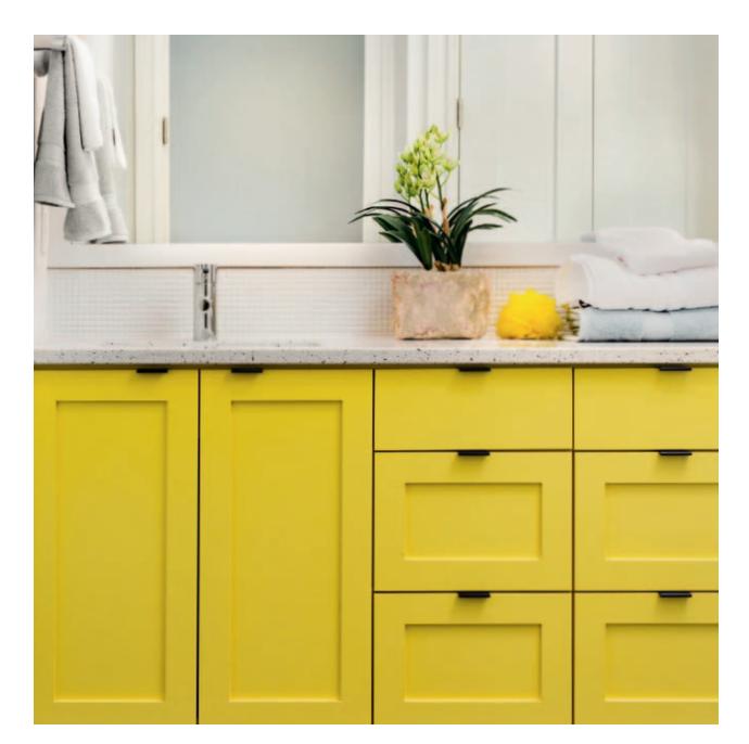 Vanity with bold colored drawer and cabinet fronts.