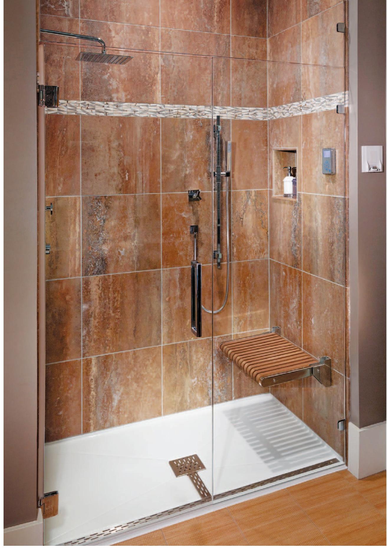 Accessible curbless shower with trench drain, seat, and handheld wand.