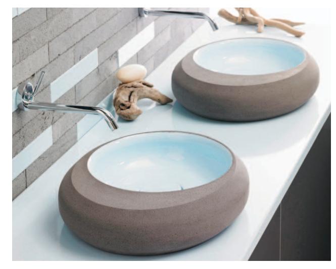Artistic sinks and counter crafted from volcanic rock.