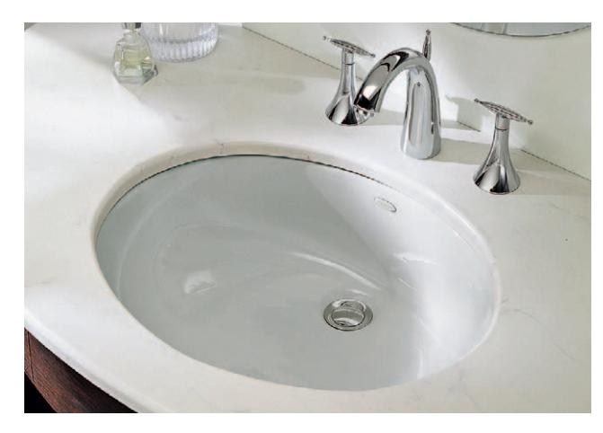 Undermount sink installed beneath a countertop.