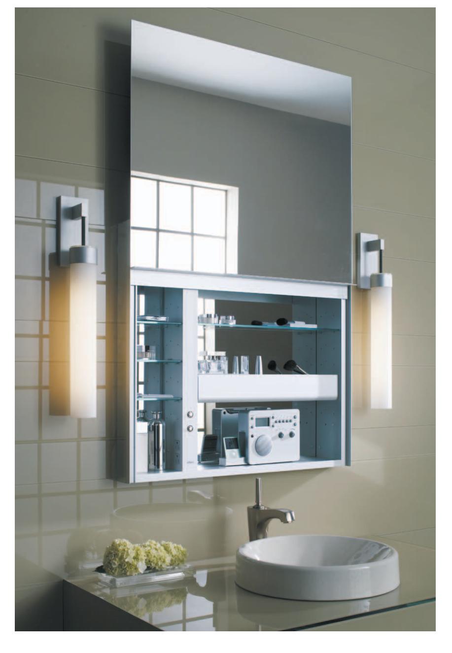 A modern medicine chest with a sliding mirror and internal outlets.