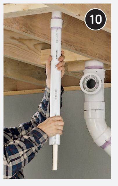 Feeding drain pipe through a hole in the sole plate.