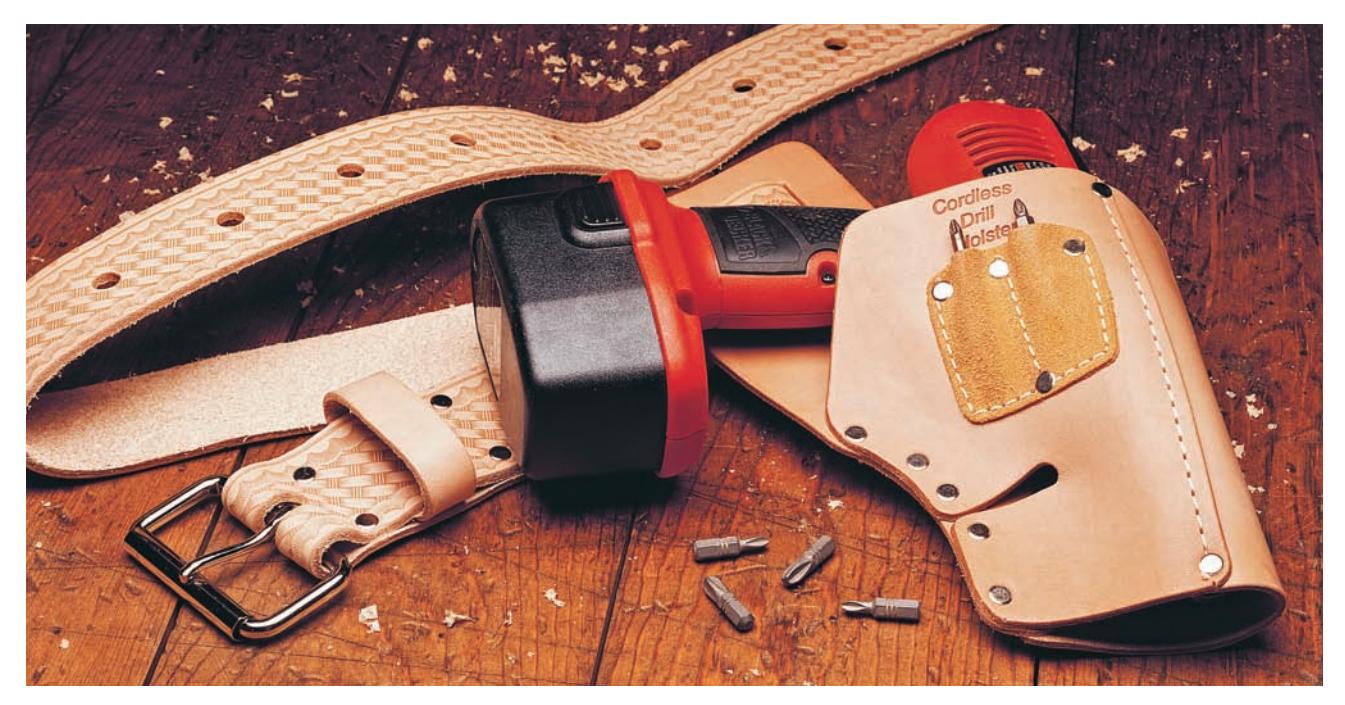 Close-up of a drill holster attached to a tool belt.