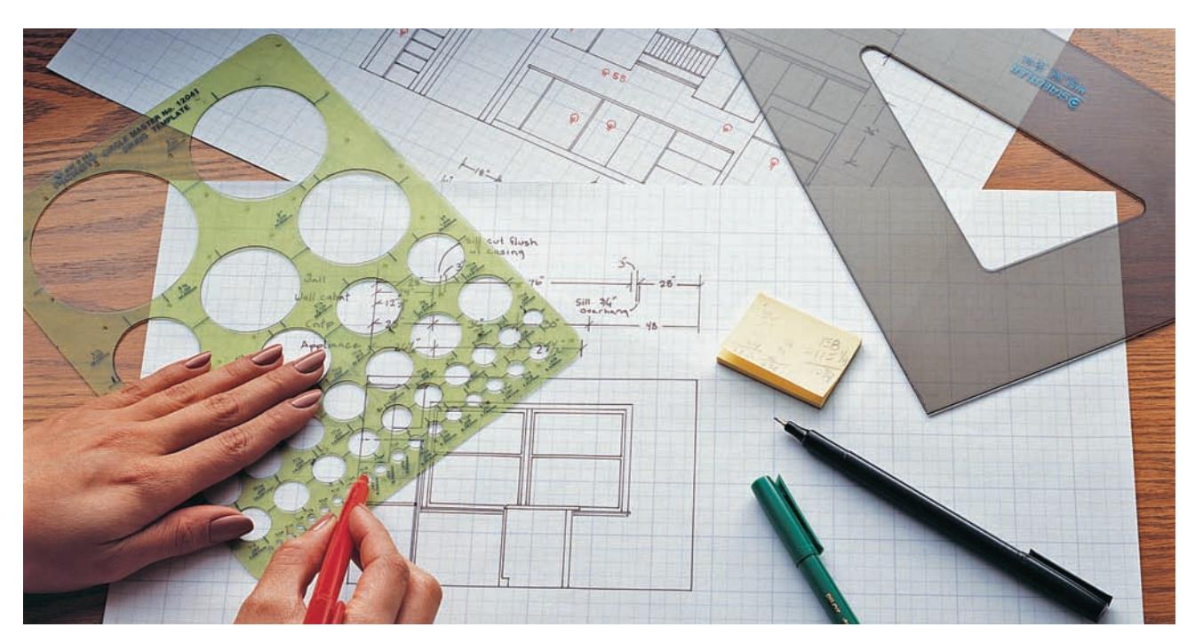 Sketching a carpentry project plan with pencil and paper