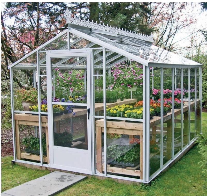 An upscale example of a handsome prefab, aluminum-framed greenhouse. Used with rubber gaskets and glass panels, this construction can easily withstand even high wind loads. The crest and finial are finished in long-lasting baked enamel. A crest like this, as well as adding flair to the greenhouse's look, also keeps birds from perching on the ridge—which in turn keeps the panels cleaner.