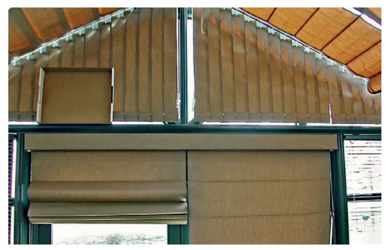 Louvered and roll-up shades on a greenhouse