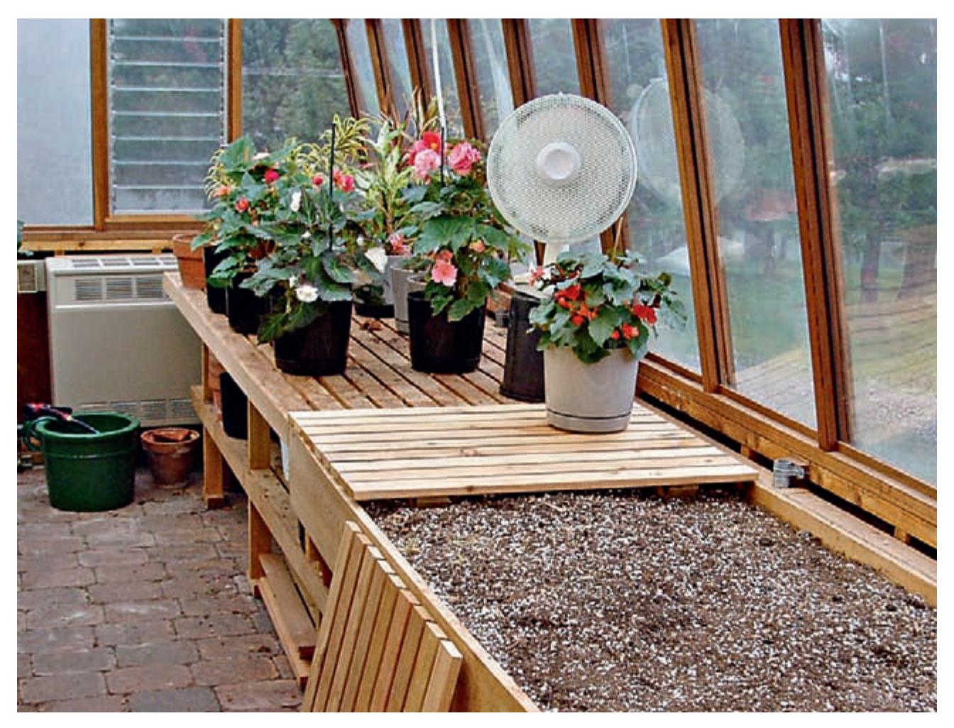 Potting benches with integrated storage for soil and tools