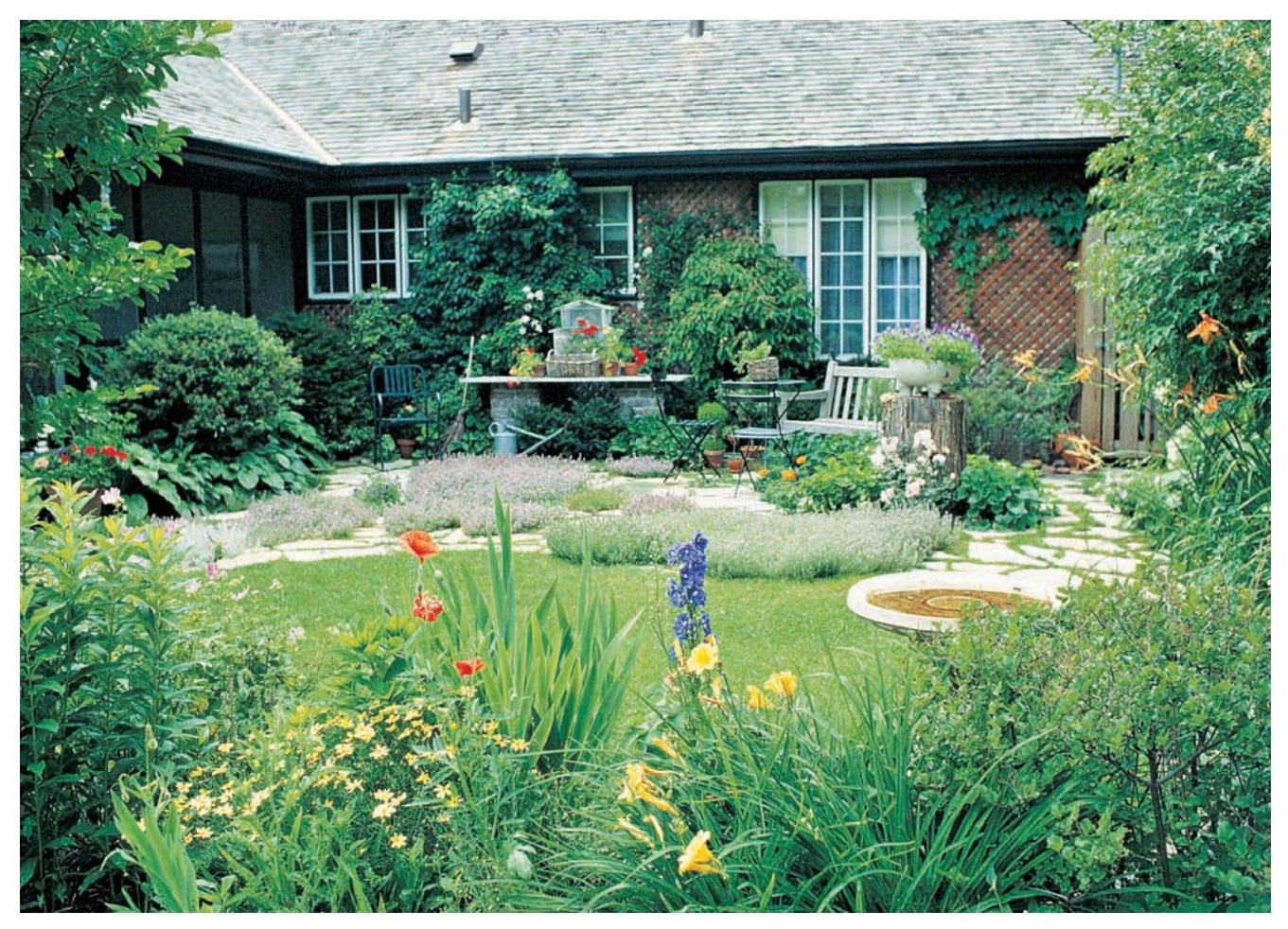 Established garden with trees, shrubs, and flowers.