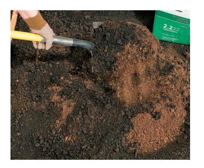 Tilling soil in a garden bed